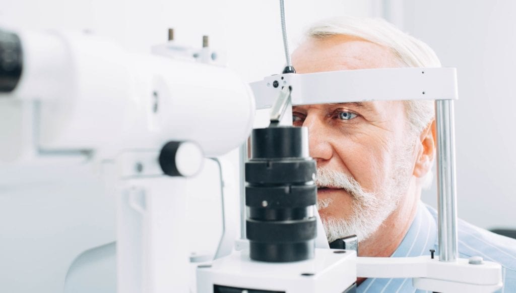 Senior man getting a regular eye exam