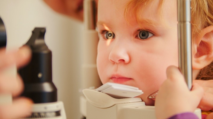 Young child having an eye exam to check for childhood eye conditions