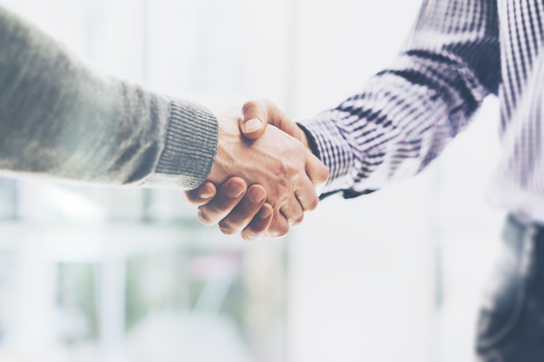 two people shaking hands